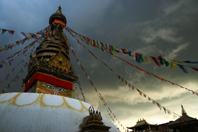 cloud - sky, Nepal, religion, outdoors, sky, place of worship, flag, built structure, architecture, bunting, Buddha, building exterior, building, belief