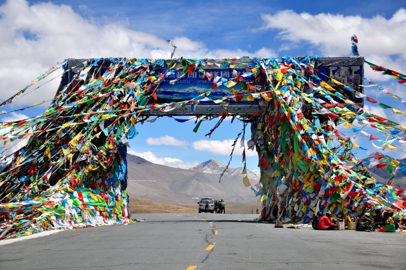 vehicle, nature, beauty in nature, highway, decoration, built structure, friendship pass, landscape, people, mountain range, incidental people, day, outdoors