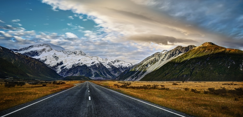 mountain, Country, com, concrete road, road, highway, scenics, travel, 8K, Cinematic, outdoors, nature, near, landscape, concrete, daytime, New Zealand