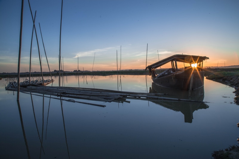 sky, tranquility, landscape, marina, reflection, boat, orange color, lake, mode of transportation, moored, india, sailboat, nature, water, tranquil scene