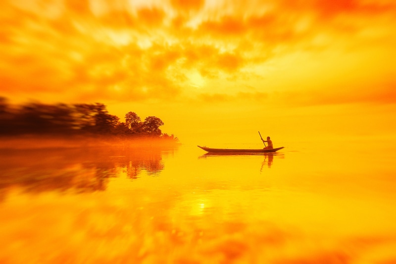 tranquil scene, tourism, beauty in nature, red, mode of transportation, tranquility, reflection, island, cloud - sky, scenics - nature, sky, orange, nature