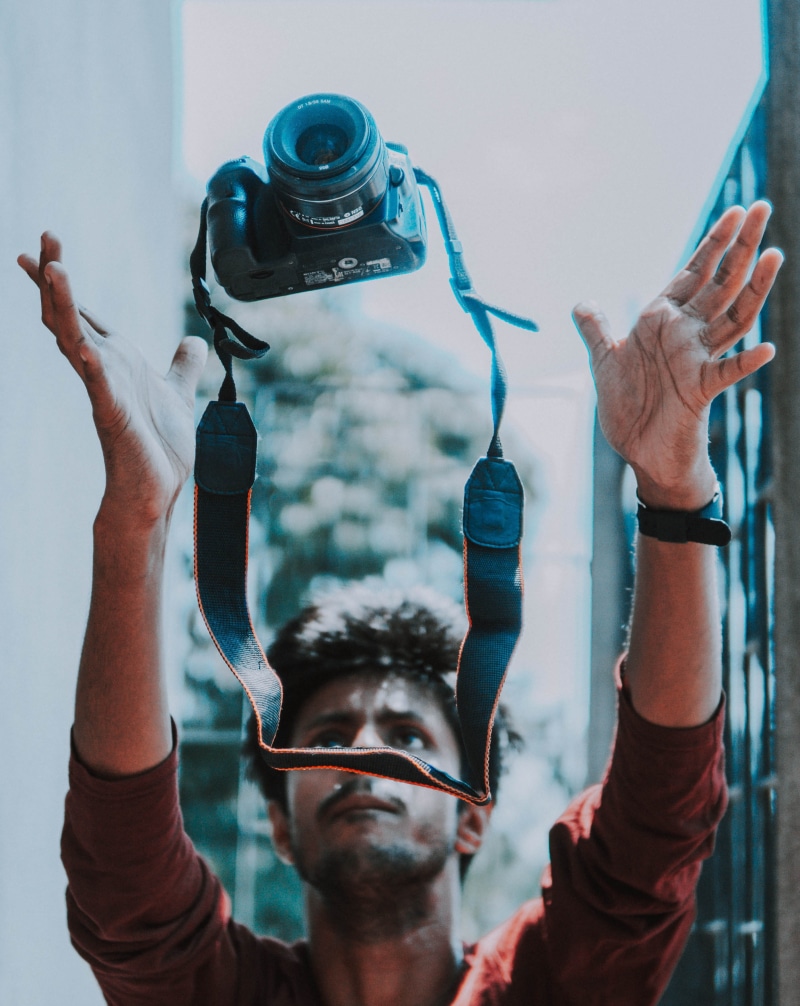one person, real people, photographic equipment, activity, glasses, human hand, hand, photography themes, photographing, holding, finger, camera - photographic equipment