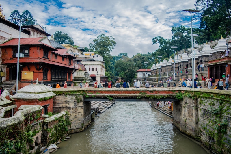 incidental people, east Asian Culture, Kathmandu, temple, sacred, religious, water, lake, tree, temple - Building, men, nature, built Structure, chinese Culture