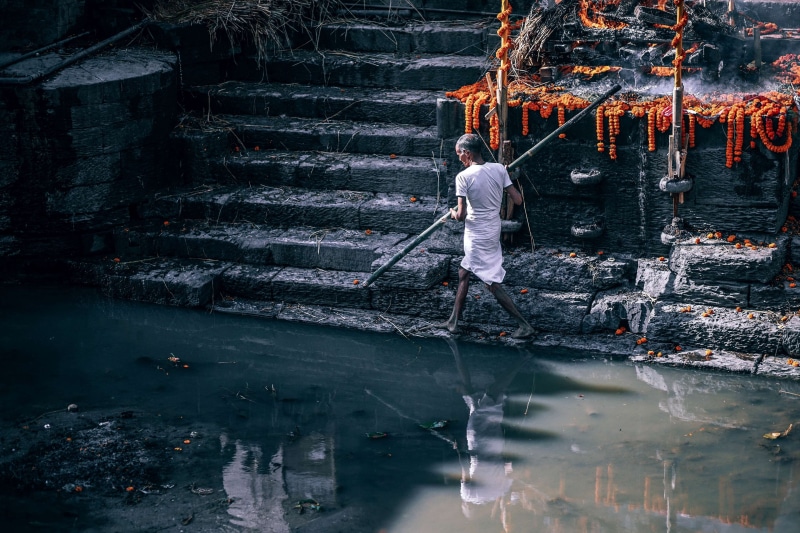 dark, lifestyles, action, life, ritual, full length, holy, human, occupation, water, rear view, light, smoke, spiritual, one person, man, nature, working