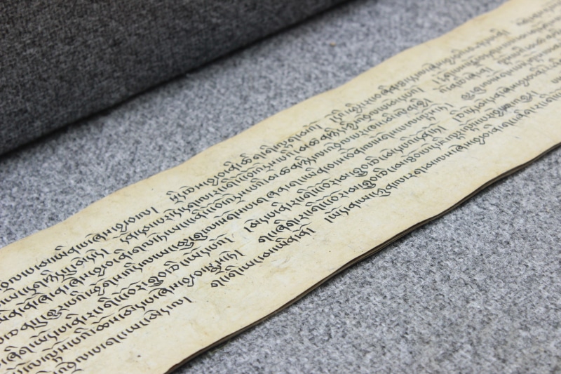 message, indoors, page, history, publication, bible, old, literature, table, communication, words, high angle view, non-western script, text, white, close-up