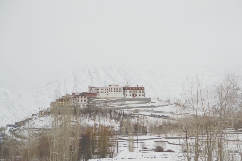 sky, copy space, mountains, beauty in nature, cold temperature, remote, phyang, building exterior, white, mountain, tibet, lake, water, frozen, building