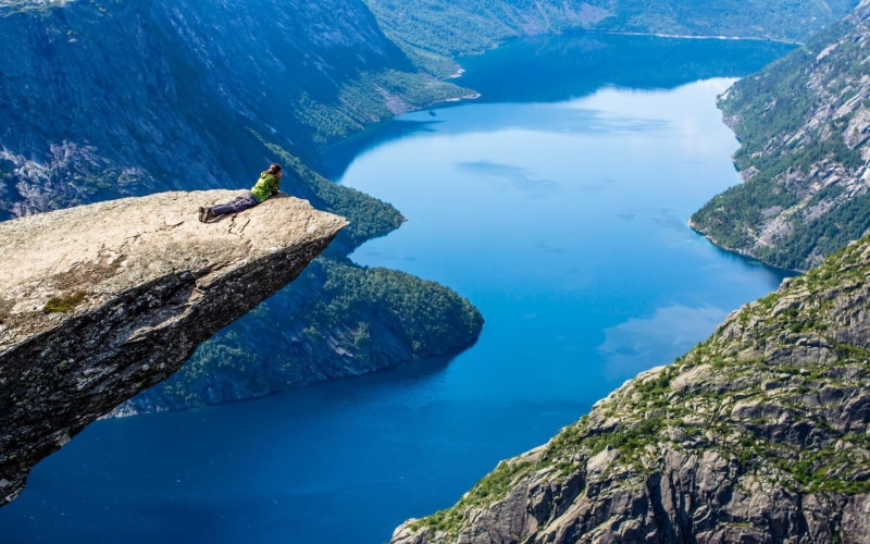valley, real people, leisure activity, men, non-urban scene, activity, Trolltunga, rock formation, scenics - nature, rock - object, outdoors, cliff, adventure