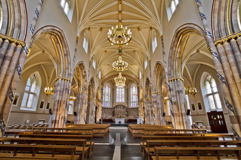 pew, no people, interior, pipe - tube, indoors, arch, chandelier, cathedral, church, ornate, history, in a row, bench table, place of worship, chandeliers