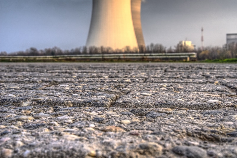 sky, transportation, outdoors, nuclear fission, bicycle path, building exterior, nuclear reactor, high voltage, nuclear energy, water, landscape, patch