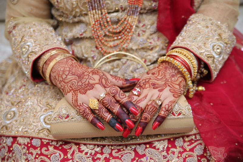 wedding, close-up, diamonds, dress, celebration, bracelet, traditional wear, female, traditional clothing, henna tattoo, design, indoors, red, event, human hand