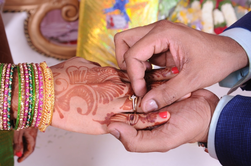 two people, indian girl, wedding ceremony, bangles, event, hand, jewelry, ring, mehandi, human body part, engagement, bracelet, tattoo, henna tattoo, couple - relationship