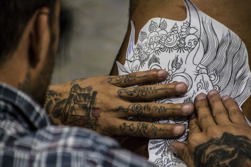machine, adult, white, body drawing, fashion, occupation, culture, alternative, henna tattoo, person, holding, midsection, tattoo, create, close-up, black
