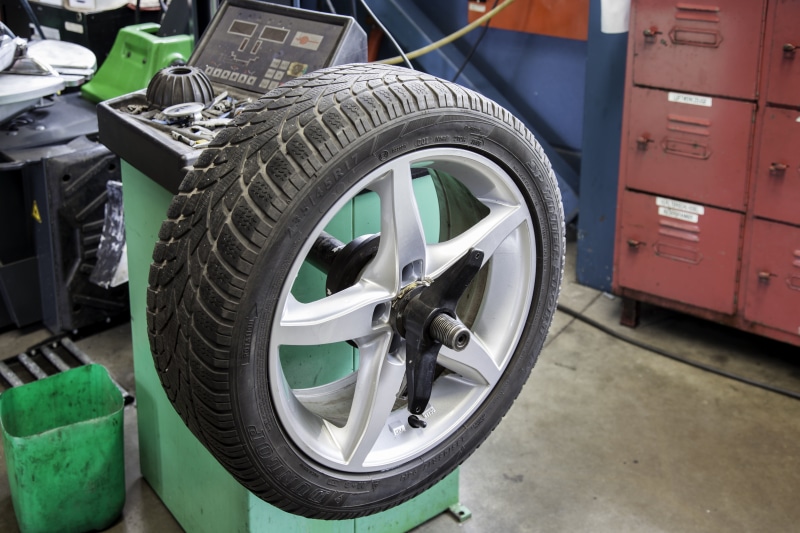 workshop, automotive, 5K, outdoors, focus on foreground, no people, transportation, auto, truck, tire service, shut off, shopping, tire, industry, metal