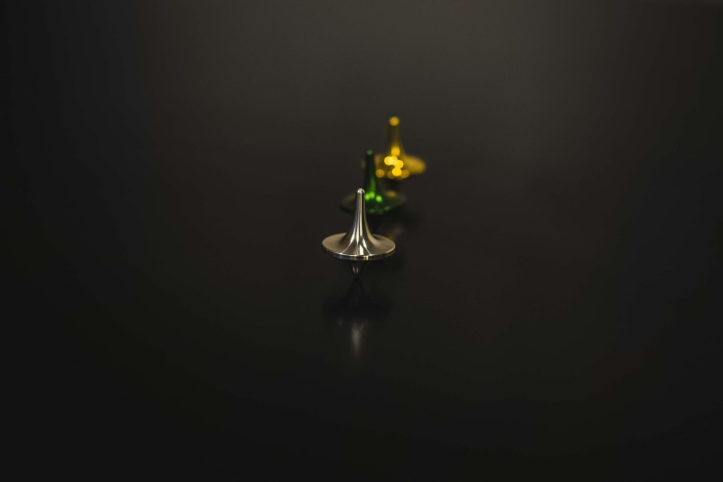 drop, close-up, candle, still life, 4K, aligned, glass, fragility, reflection, no people, black background, aluminium, metals, spinning top, indoors, glass - material