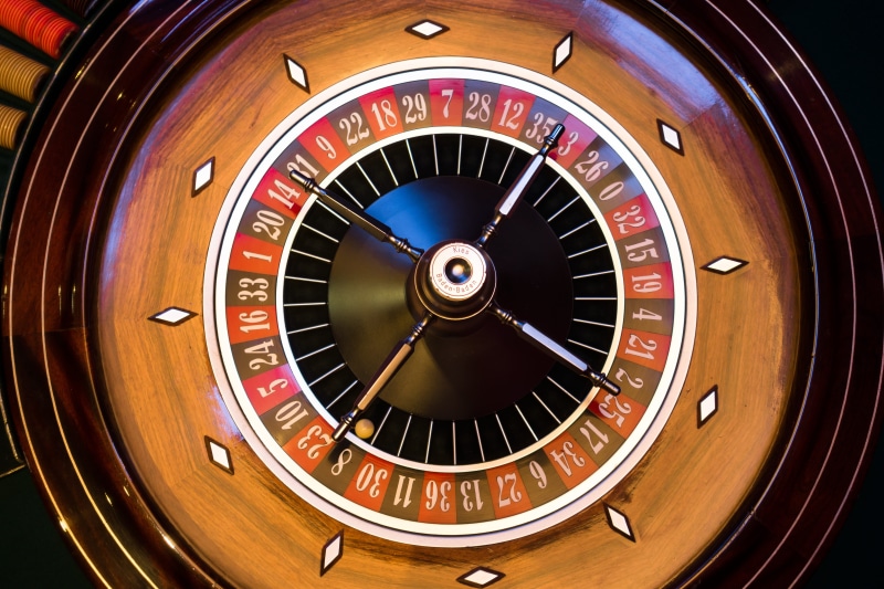 movement, roulette, leisure games, luck, play, technology, wooden, round, business, time, consumerism, indoors, brown, out of focus, gambling, no people