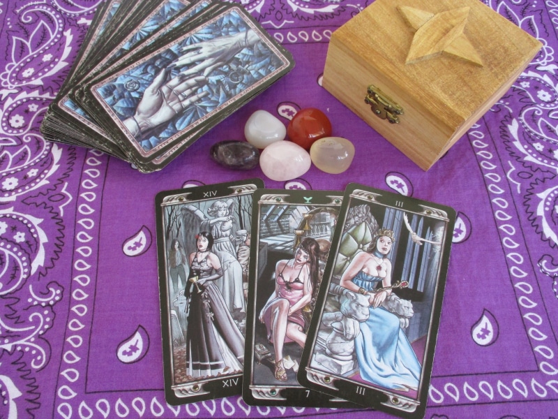 human representation, box, indoors, event, no people, paper currency, belief, still life, Occultism, cards, art and craft, celebration, scarf, stone, female likeness
