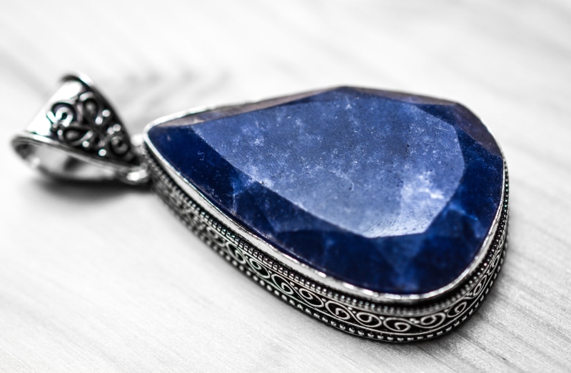 no people, treasure, healing, silver, single object, mineralogy, gem, studio shot, shiny, wooden table, close-up, astrological, gray, luxury, aquarius