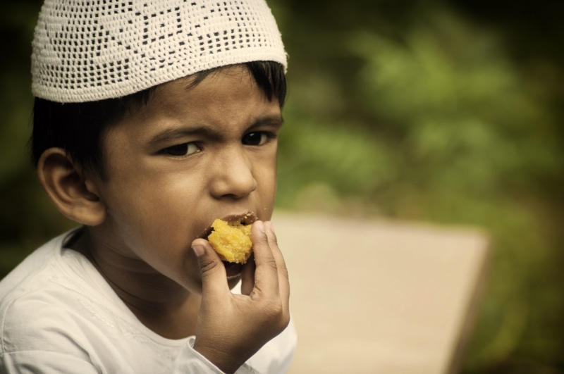 focus on foreground, holding, casual clothing, food and drink, muslim, headshot, hungry, men, fasting, thobe, males, festival, selective, religion, eating
