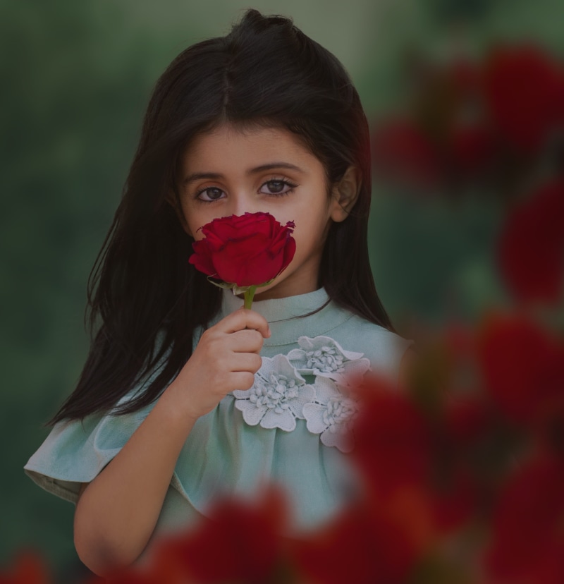 fashion, flowering plant, face, person, human, happiness, red, front view, cute, childhood, beautiful woman, young, innocence, smile, rose, female, white