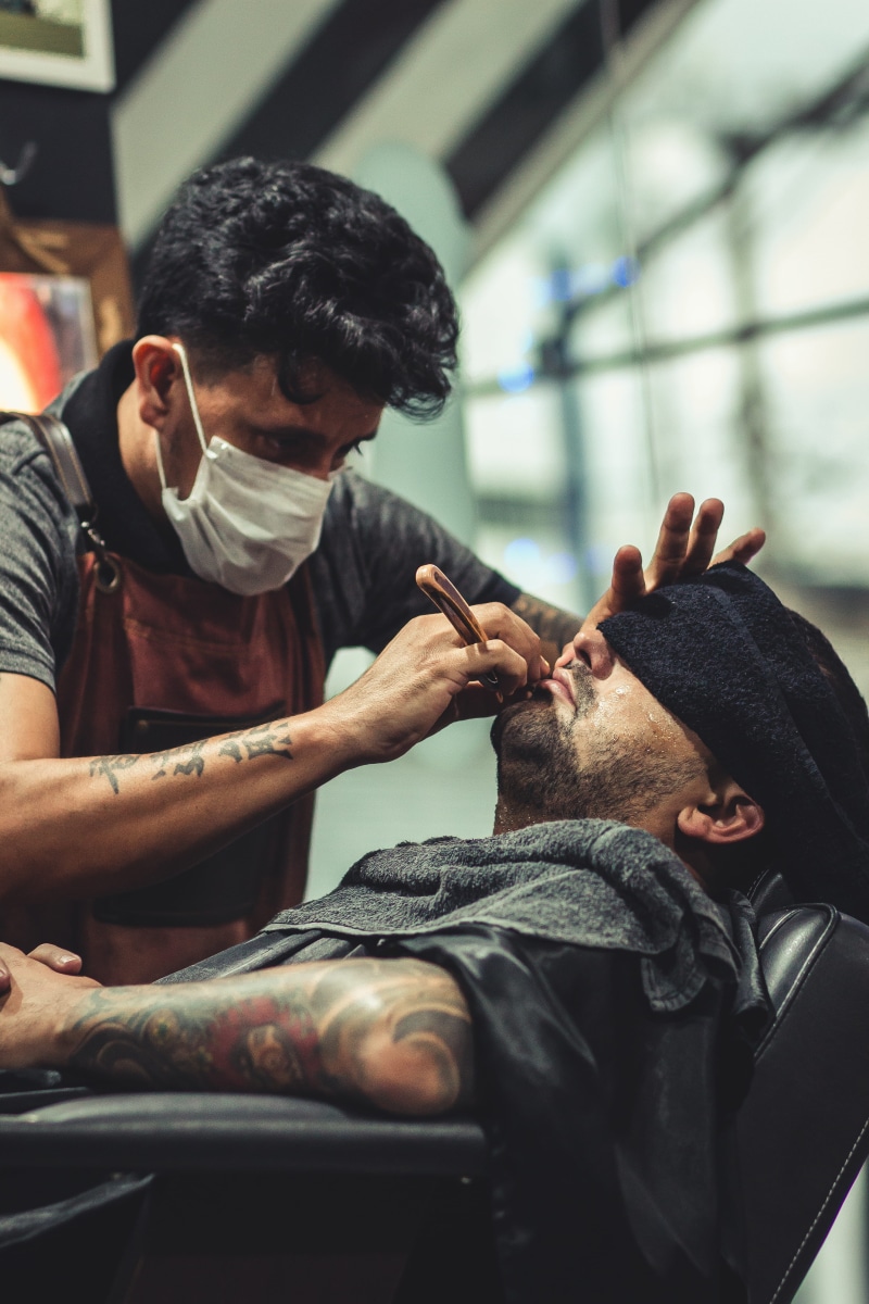hairdresser, facial expression, young adult, man, cover, customer, razor, barbershop, two people, indoors, relaxation, s, barber shop, wear, facial hair