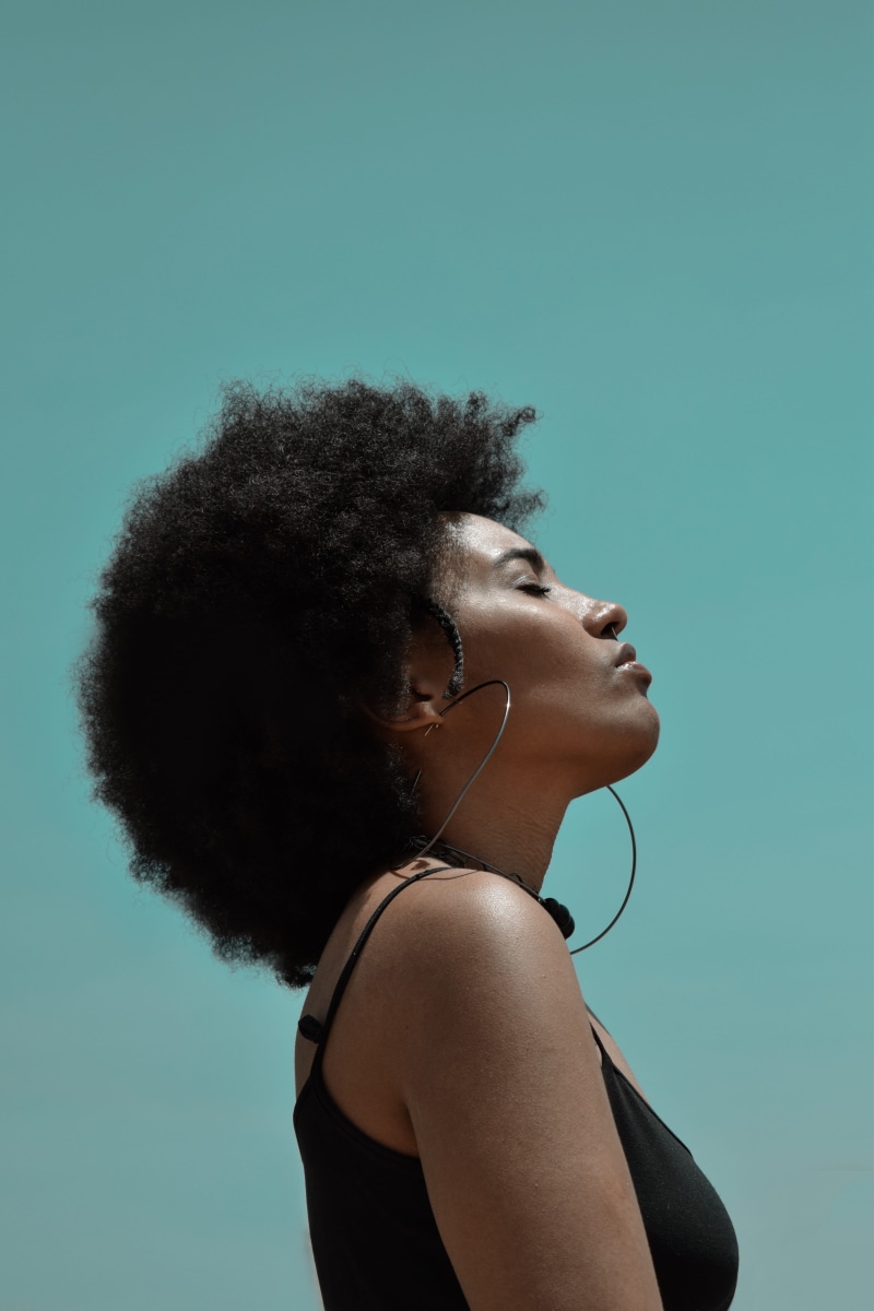 curly hair, sideways, standing, person, headshot, 5K, young women, fashion, blue, lifestyles, hairstyle, woman, young adult, style, headphones, wear, leisure activity