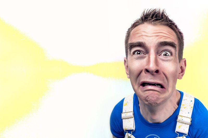 funny face, eyebrow, studio shot, making, adult, crazy, 5K, eyes, blue, face, man in blue, looking At Camera, human body part, goofy, crew-neck, making a face
