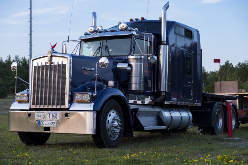 black, outdoors, parked, trucking, wheel, field, vice, industry, freight transportation, plant, long hauber, semi, transport, day, sky, land vehicle, truck