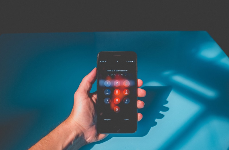 apple, human hand, studio shot, control, blue, phone, blue background, connection, technology, red, security, smart phone, iphone, person, mobile phone