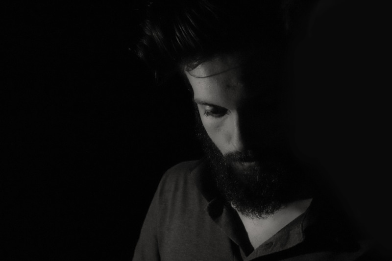 studio shot, model, black, adult, young men, person, low key, white, dark, one person, young adult, body part, depression - sadness, sad, hair, face, beautiful