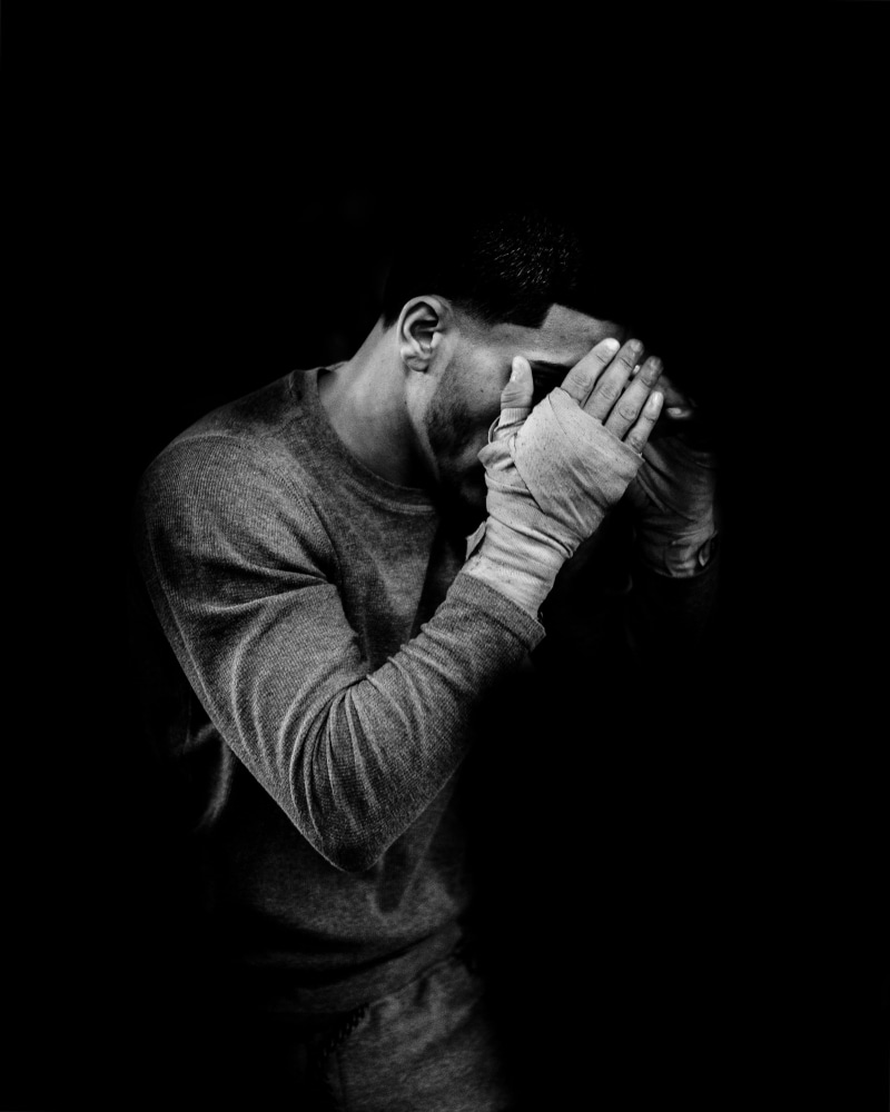 casual clothing, head In Hands, dark, shirt, copy space, despair, emotion, neck, mid adult, hood, black And White, mammal, studio Shot, looking at camera