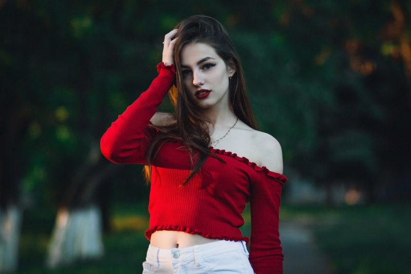 women outdoors, beauty, black nails, red lipstick, leisure activity, depth of field, hair, portrait, young adult, hands on head, fashion, necklace, waist up