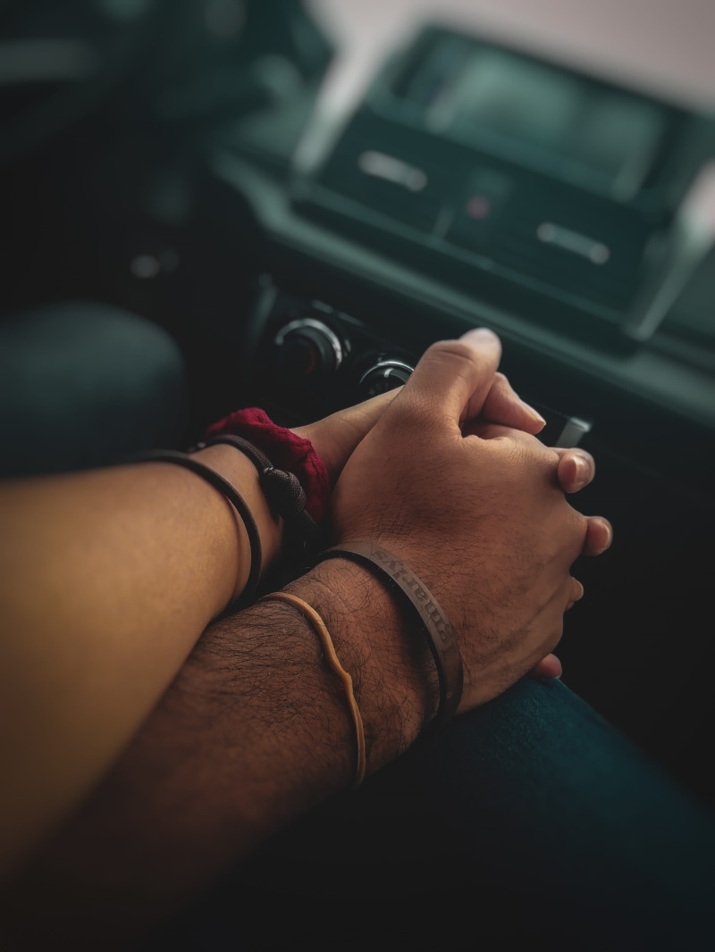holding, lifestyles, couple, closeup, 4K, real people, body part, bracelets, travel, personal perspective, feelings, car, mode of transportation, indoors