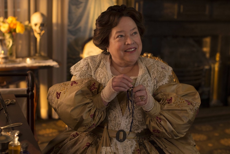 portrait, one person, real people, holding, american horror story, smiling, clothing, focus on foreground, hands clasped, emotion, three quarter length