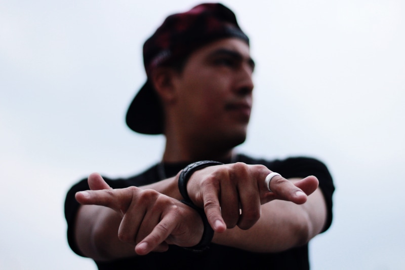 headshot, guy, human hand, fingers, hand, person, close-up, hands, ring, gesture, fashion, headwear, portrait, cap, adult, signs, front view, bracelet