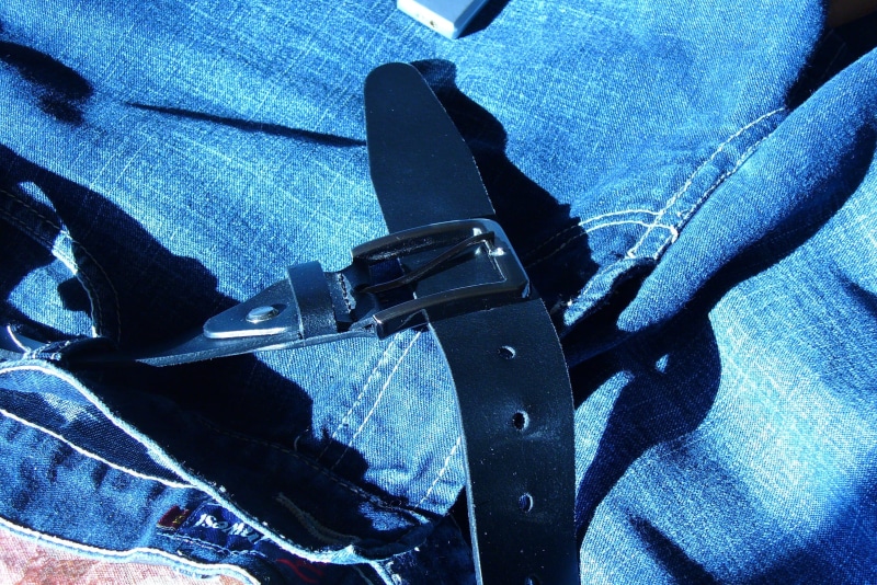human hand, stylish, indoors, men, casual, one person, lifestyles, strap, zipper, unrecognizable person, waist, fasten, close-up, textile, personal perspective