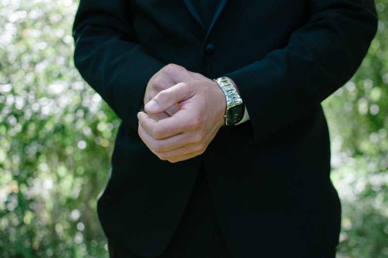 jewelry, one person, human hand, men, standing, groom, suit, formal, close-up, wristwatch, outdoors, human limb, man, hands clasped, time, day, waiting