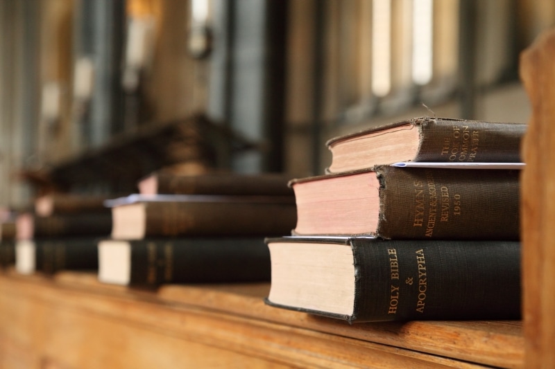 focus on foreground, studying, close-up, old, library, books, justice - concept, church, courthouse, praying, publication, belief, bookshelf, law, industry