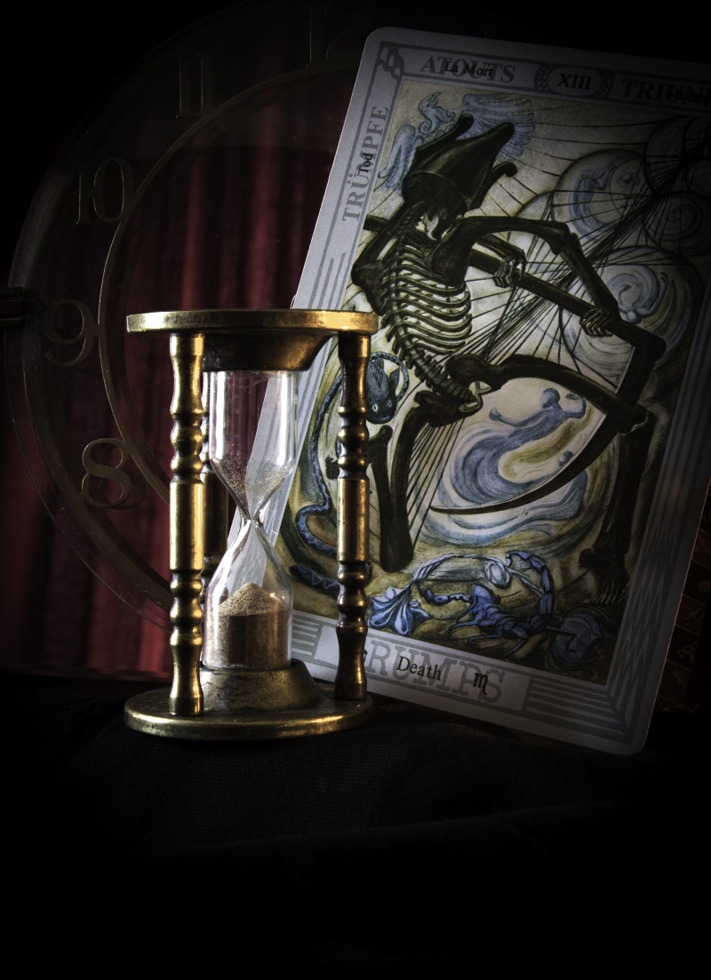 symbol, closeup, glass, representation, arts culture and entertainment, hour, creativity, card, still life, justice - concept, time, mystery, studio shot