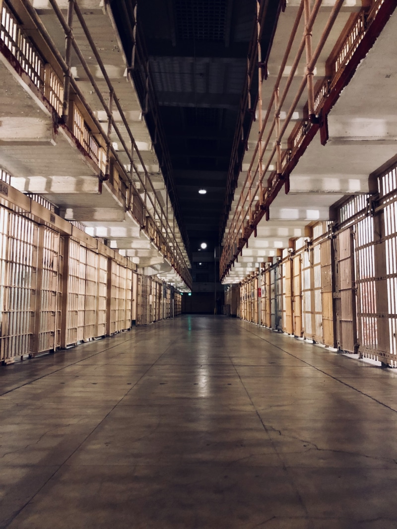4K, long, cells, absence, illuminated, the way forward, diminishing perspective, prison cell, no people, punishment, bars, prison, flooring, ceiling, lighting equipment