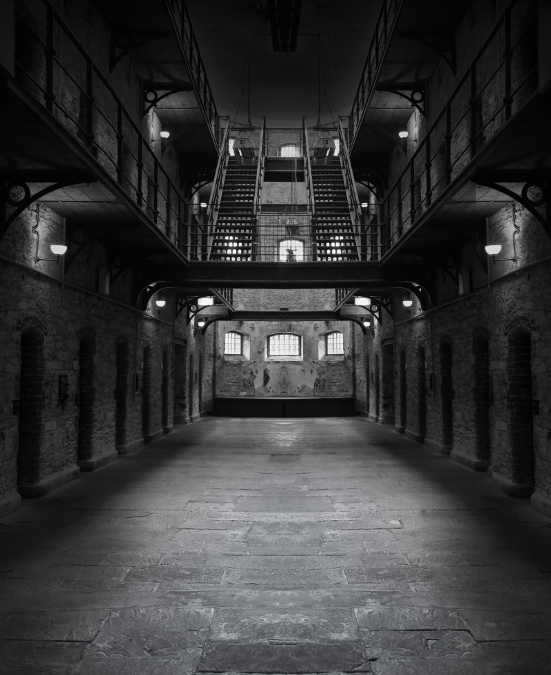 indoors, dark, in a row, diminishing perspective, empty, illuminated, gray, jail, the way forward, building, staircase, prison, no people, built structure