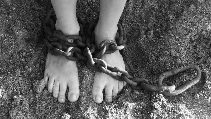 togetherness, prisoner, land, restraining, kidnapping, two people, lock, real people, person, bondage, dirty, captivity, enslave, prison, grayscale, sand