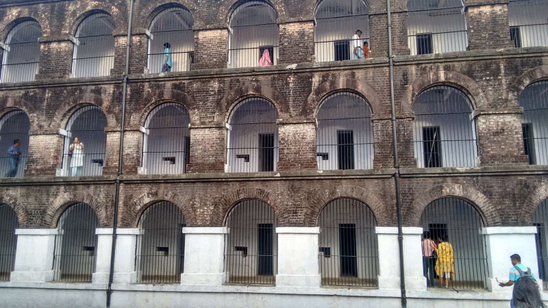 the past, built structure, cellular jail, architectural column, travel destinations, women, arch, leisure activity, window, adult, men, jail, building