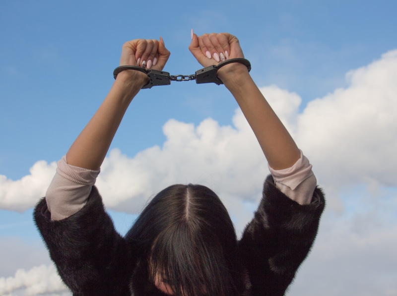 body part, hands, dependent, 4K, holding, arms raised, raising, hairstyle, black, real people, one person, black and white, gray, arrested woman, white