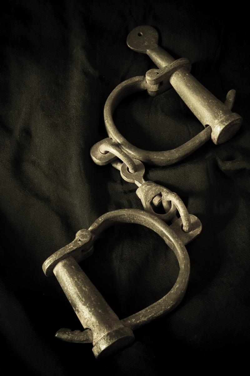 Law, criminal, studio shot, wall - building feature, chain, high angle view, close-up, night, Handcuffs, old, justice, wood - material, dark, history, still life