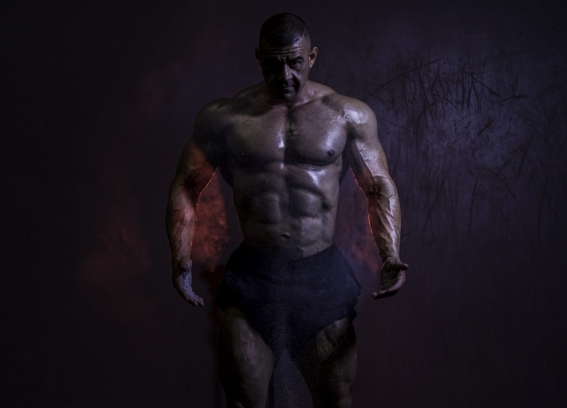 chest, studio shot, standing, body, sportsman, strength, indoors, muscular build, front view, mature adult, bodybuilding, dark, three quarter length, 2K