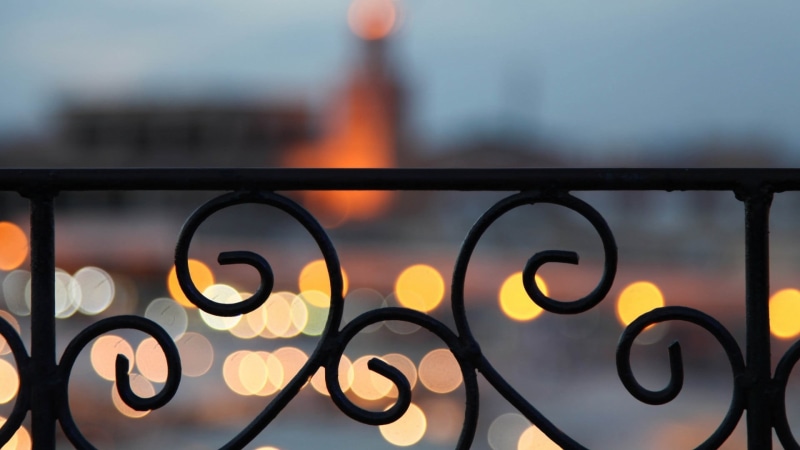 wrought, close-up, no people, outdoors, sunset, nature, illuminated, grid, architecture, black, railing, wrought iron, focus on foreground, iron, ornate