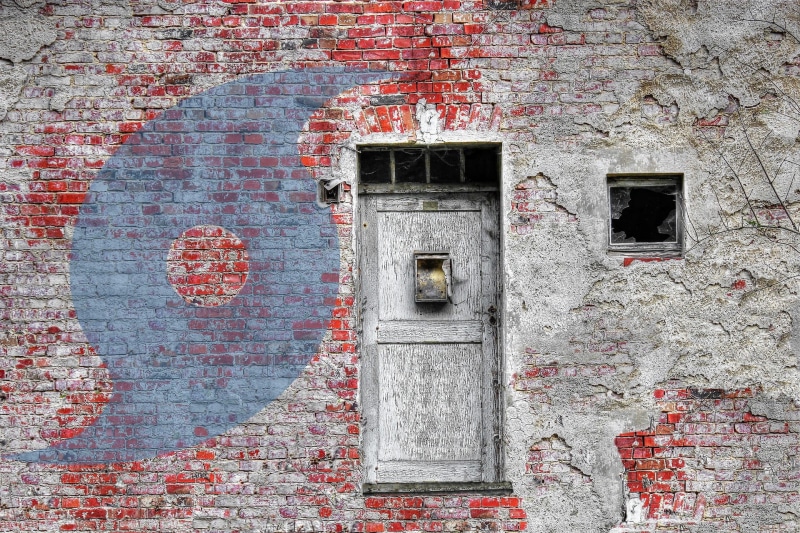 round, window, natural, wood - material, sign, damaged, air, motion, wall - building feature, built structure, icon, meteorology, brick, hurricane, dangerous