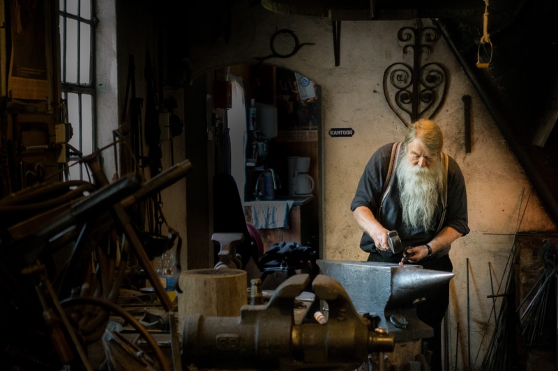 indoors, men, business, craft, one person, male, man, workbench, workshop, mallet, working, concentration, skill, hammer, three quarter length, real people