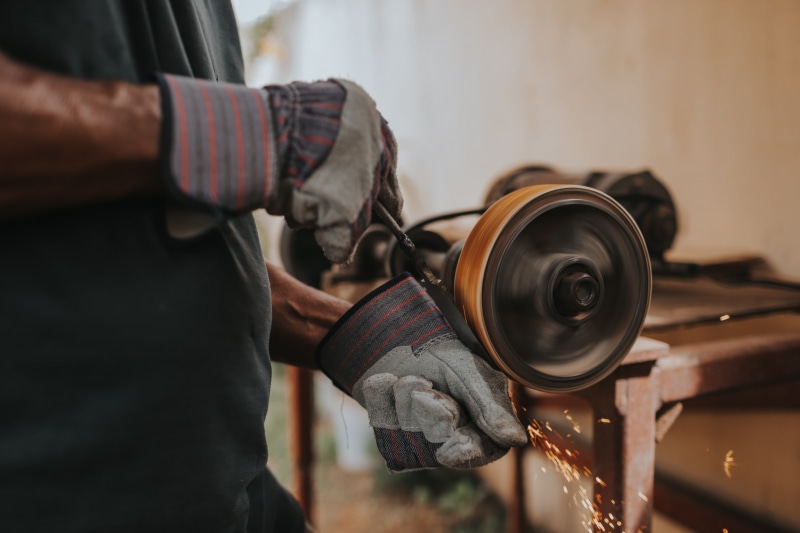 black, close-up, by hand, human hand, blacksmith, skill, work tool, holding, occupation, tool, grinder, standing, real people, iron, hand, power, 5K, indoors