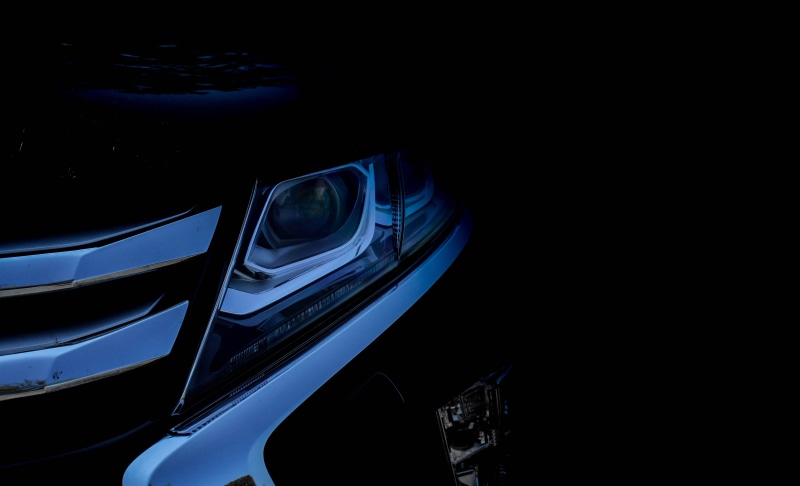 bumper, car headlight, night, vehivle, mode of transportation, eclipse cross, transportation, black color, black background, motor vehicle, car, car front